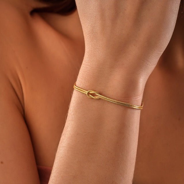Elske | Minimalistische armband met liefdesknoop - Goud