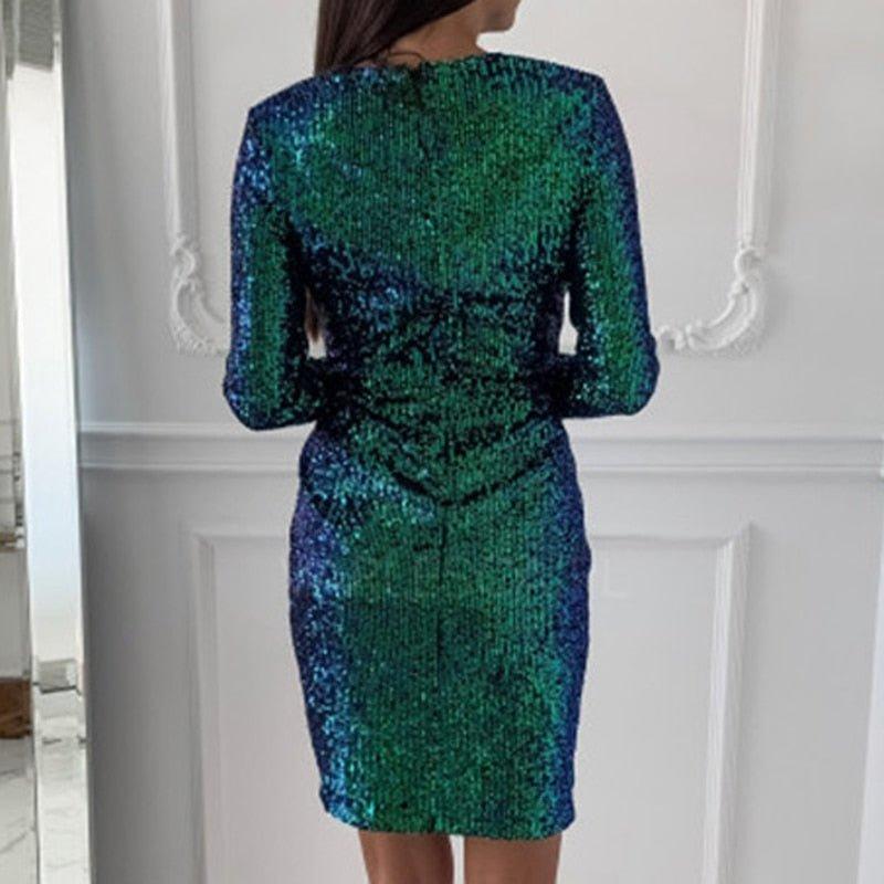 Glitterjurk. Jurk met lange mouwen. V-Hals. Victoria Mae